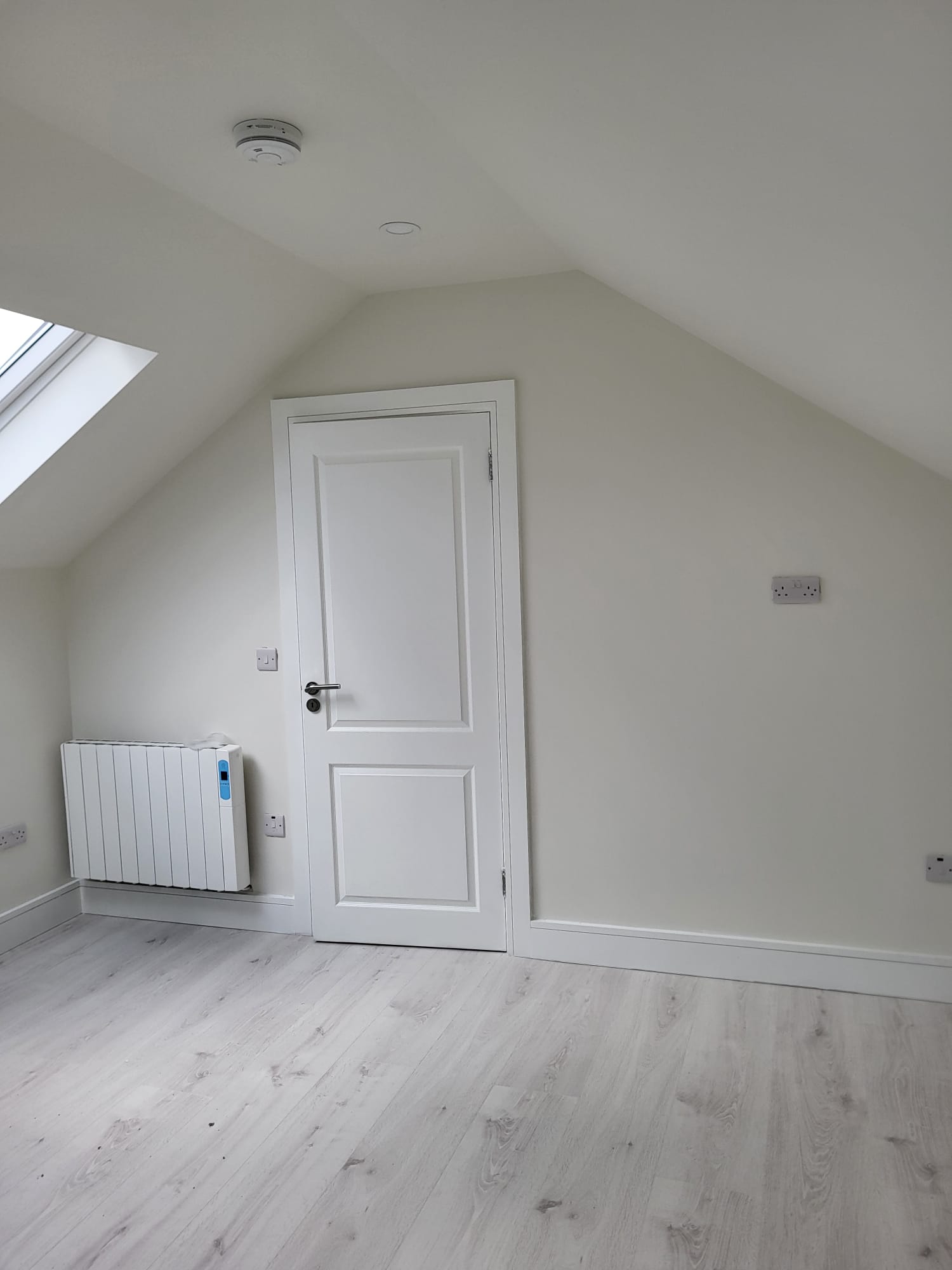 Loft room with vaulted ceiling